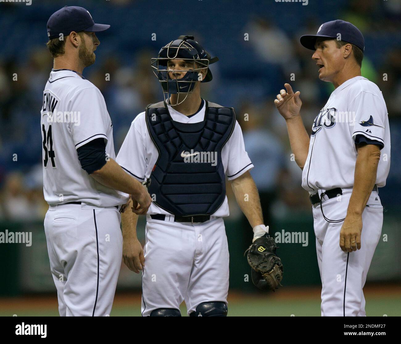 Tampa Bay Rays pitching coach Jim Hickey, right, talks to starting