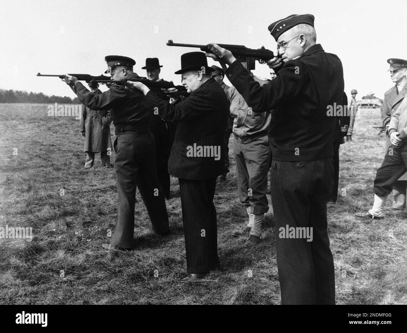 Allied war chiefs escorting Britain's prime Minister Winston Churchill on a tour of inspection