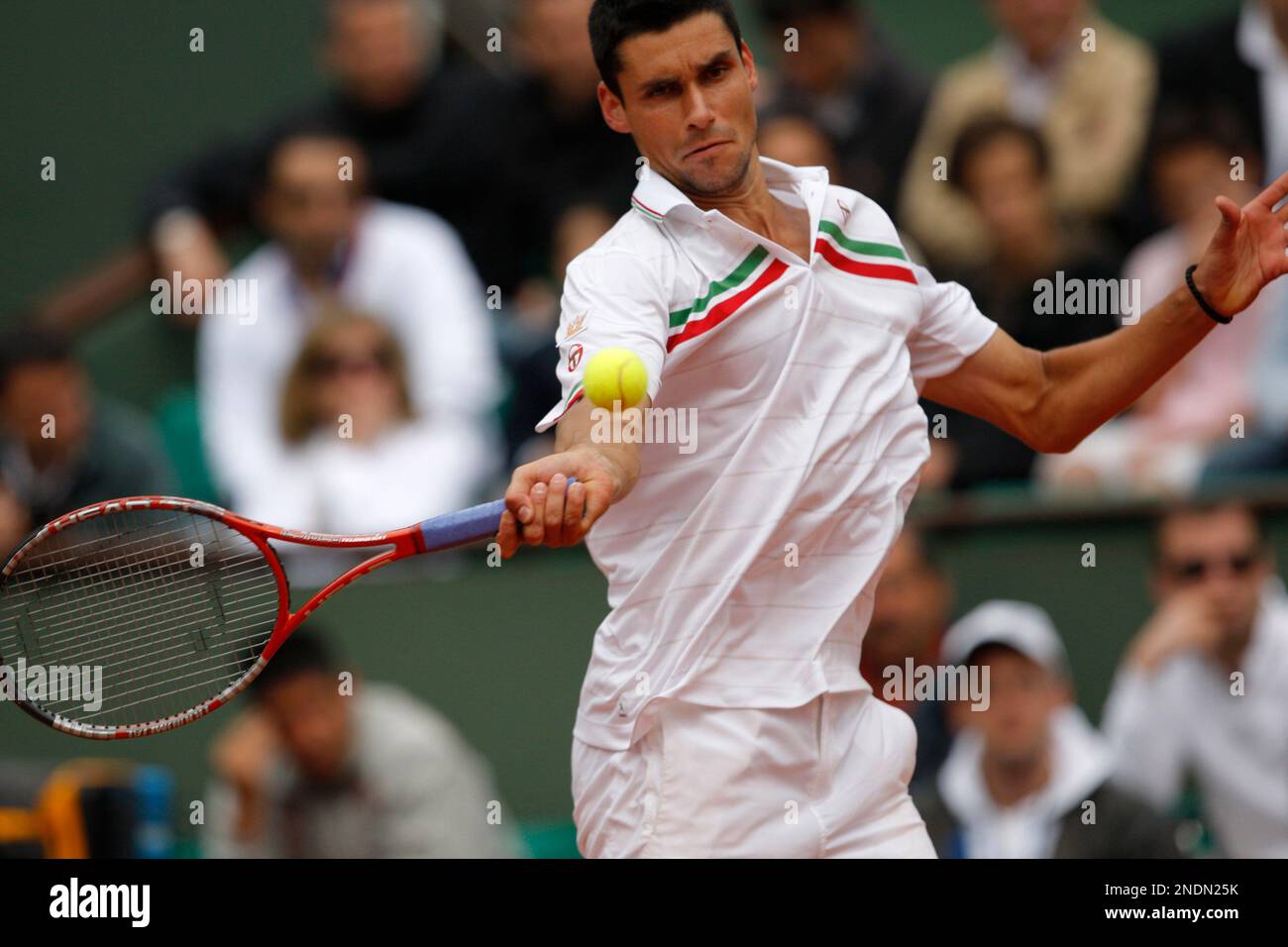Romania's Victor Hanescu returns the ball as he plays Serbia's Novak  Djokovic during their third round match for the French Open tennis  tournament at the Roland Garros stadium in Paris, Saturday May