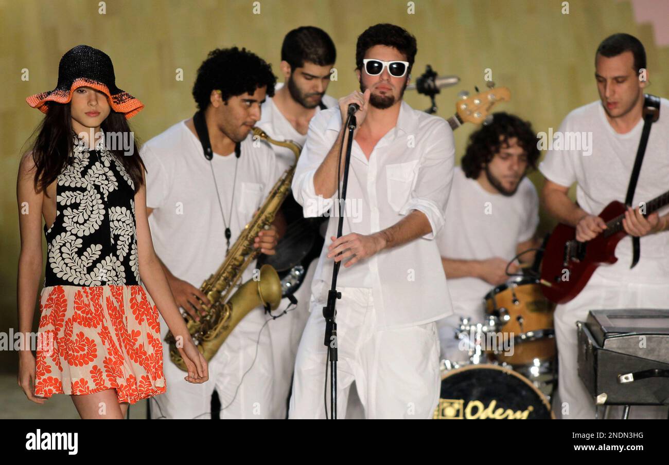 A model, left, wears a design from the Totem collection at the 