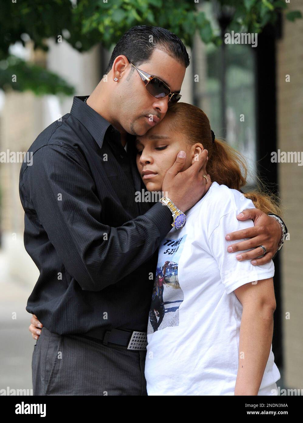 Genaro Moran Lima, left, comforts his aunt, Janet Lima, outside the wake  for their uncle and brother, respectively, the former Major League Baseball  pitcher Jose Lima, at Coppola-Migliore Funeral Home in the