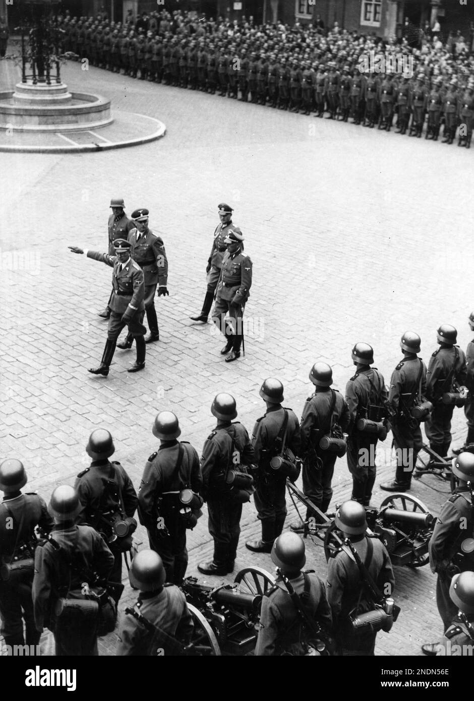 Reich commissioner Seyss Inquart inspects the enlisted Totenkopf Battalion at the Binnenhof. Its official name was Totenkopf Standarte, part of the Waffen SS. They were involved in the February strike in 1941. Text strip attached to photograph. Stock Photo