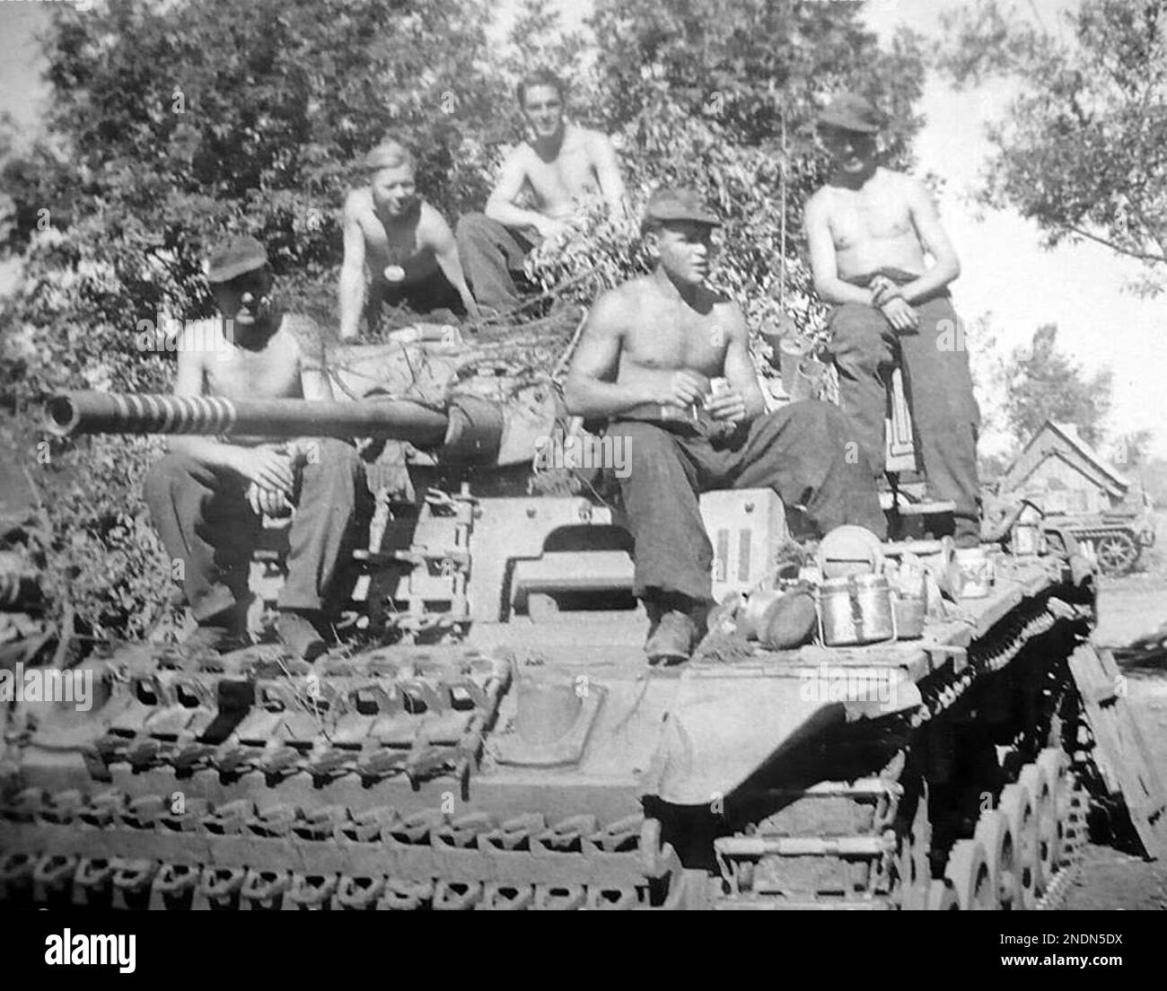 Soldiers of the 3rd SS Panzer division "Totenkopf" on board their Panzer III tank at Kursk, Russia in 1943. Stock Photo
