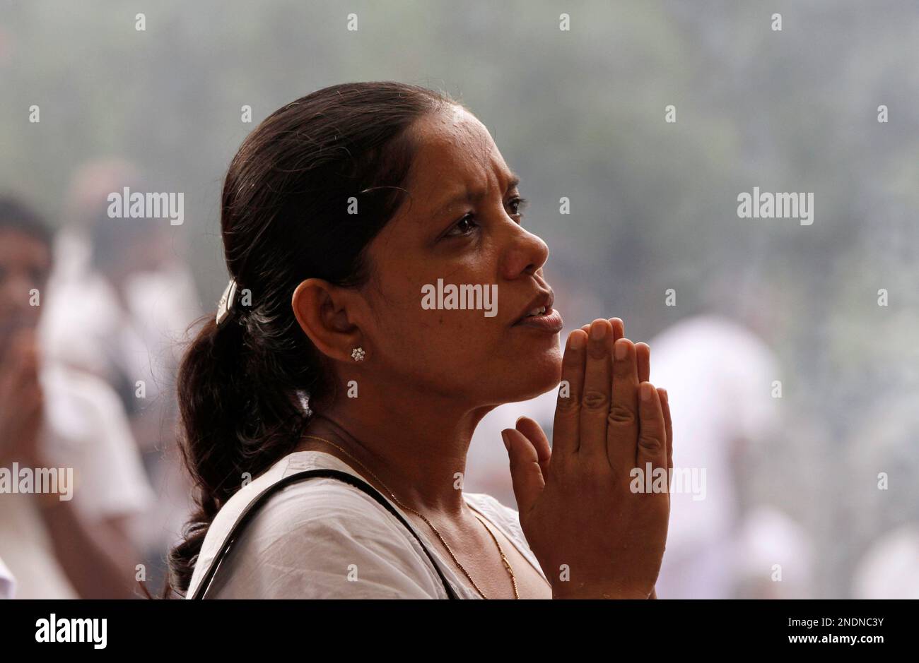 A Sri Lankan Buddhist offers prayers during Vesak festival in Colombo