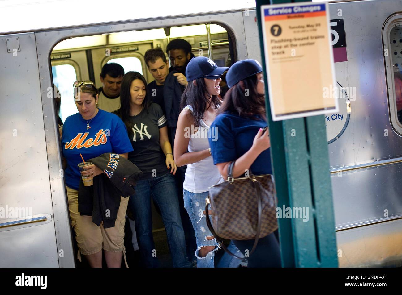 New York Mets and New York Yankees fans leave the No. 7 train as