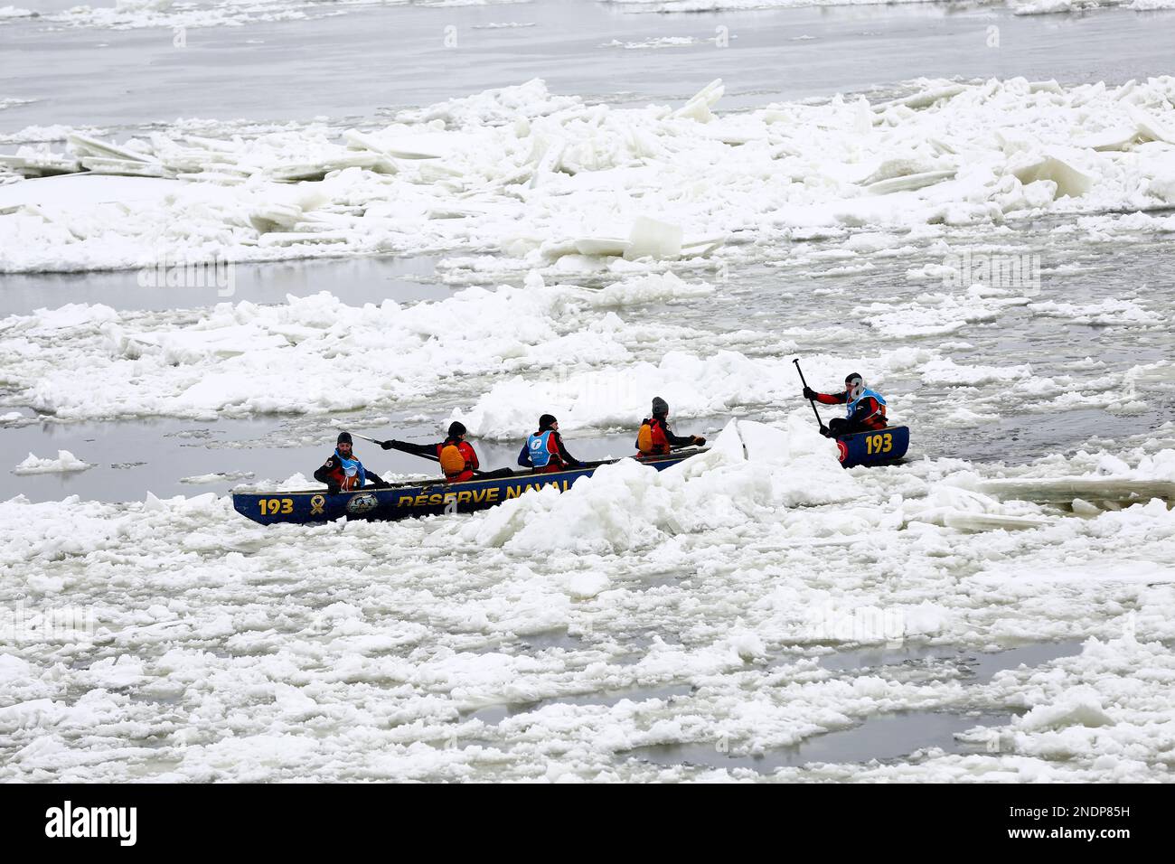 Quebec, Canada - February 5, 2023 : This is the Quebec Ice Canoe Race Competition that happens on the St.Lawrence River every winter. Stock Photo