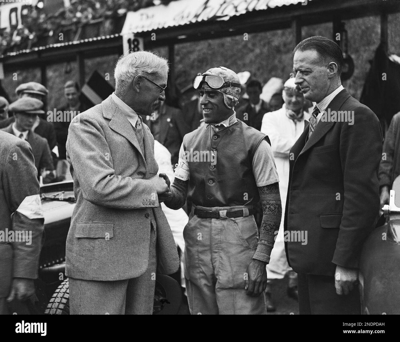 Britain's Prime Minister Ramsay MacDonald, left, shaking hands with