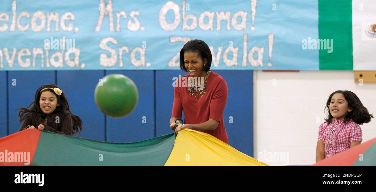First lady Michelle Obama participates in gym activities with students