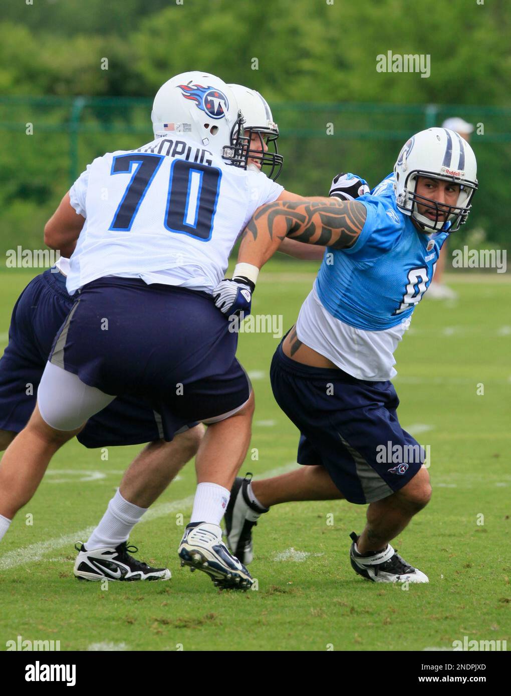 Tennessee Titans offensive tackle Troy Kropog talks on the phone in the  Titans' locker room at their practice facility on Monday, Jan. 3, 2011, in  Nashville, Tenn. Players cleaned out their lockers