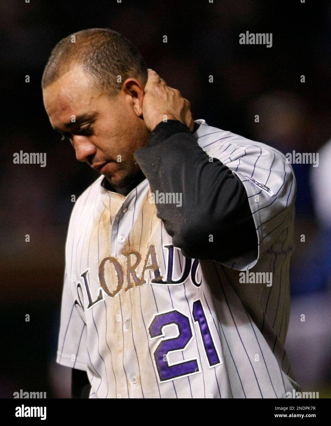 Colorado Rockies' Miguel Olivo, left, follows the flight of his