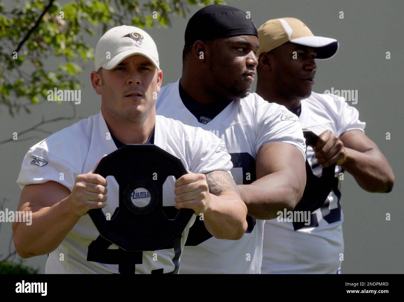 St. Louis Rams players, from left to right, Chris Massey, Mark Lewis ...