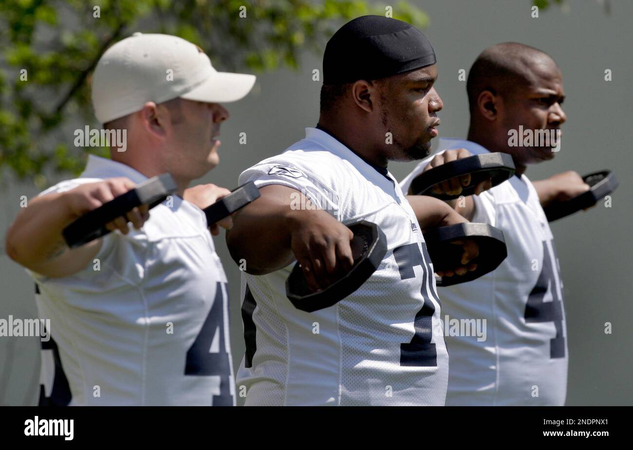 St. Louis Rams players, from left to right, Chris Massey, Mark Lewis