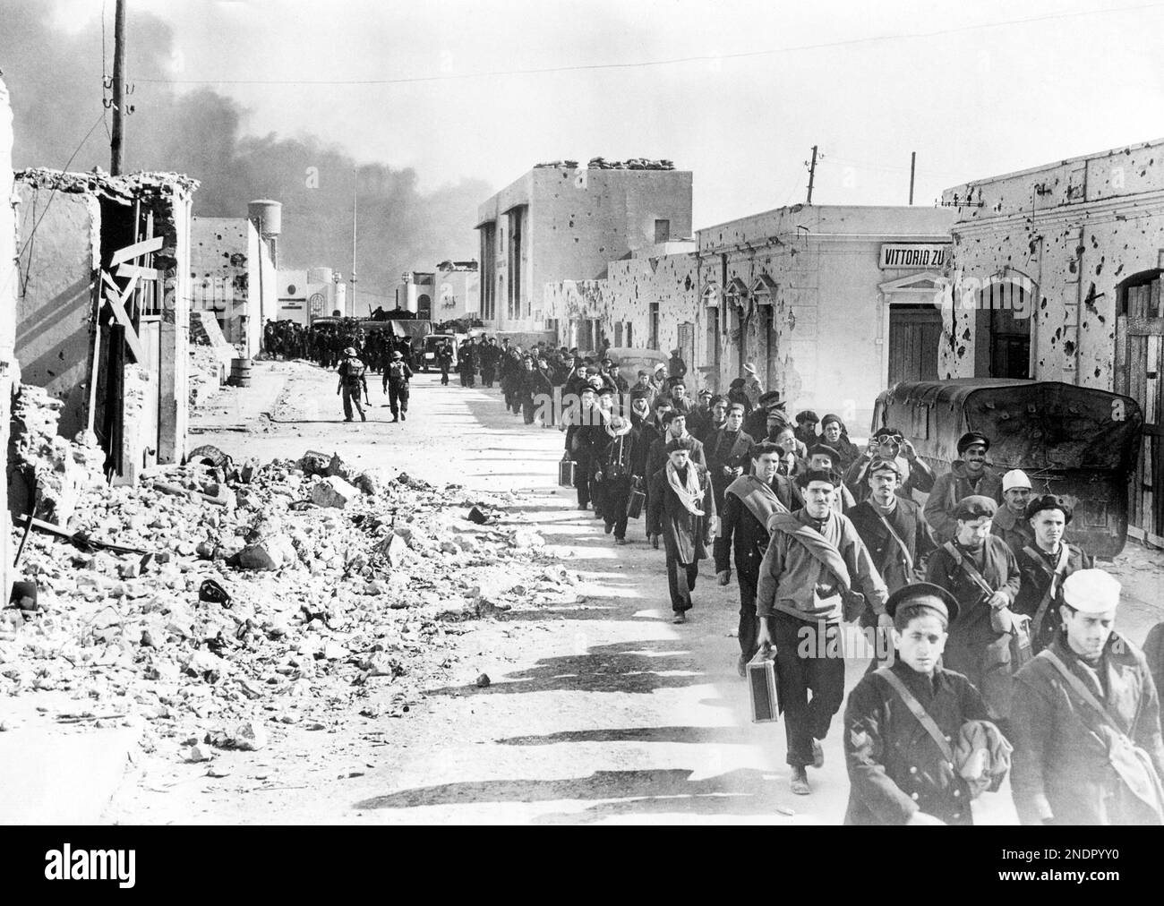 Italian naval men, captured by the British on the fall of Tobruk, march ...