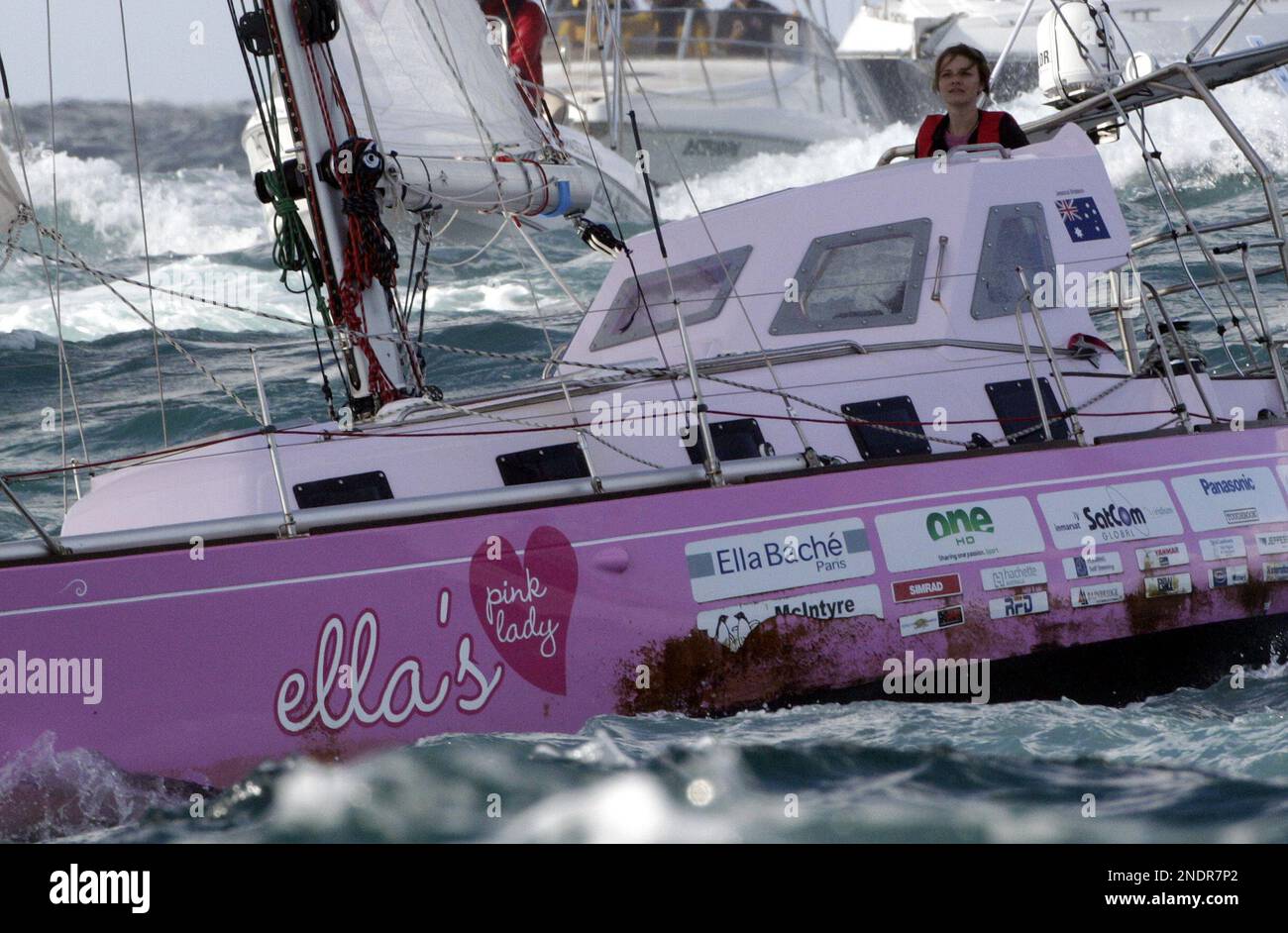 Sixteenyearold Jessica Watson sails past the finish line at the