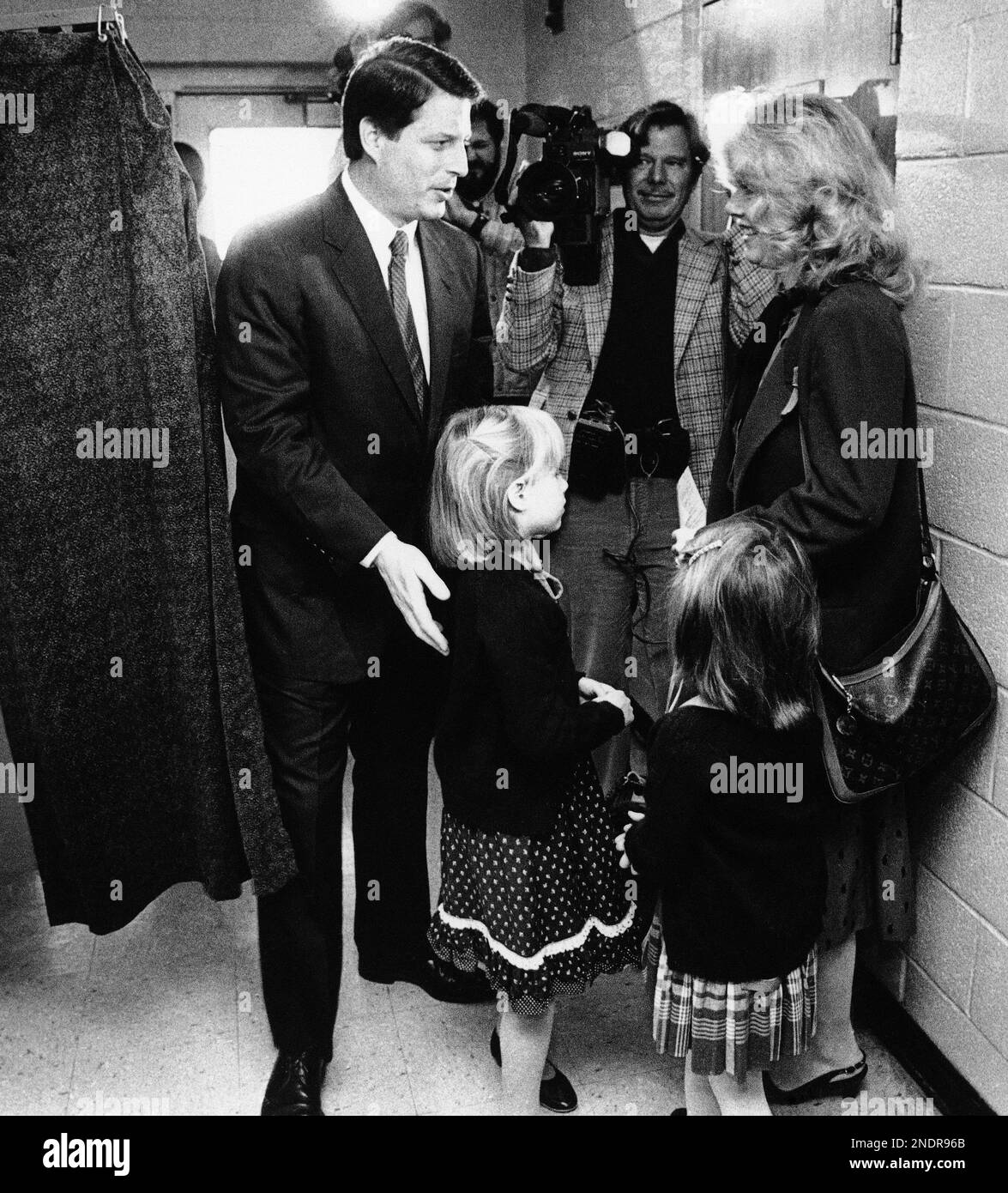 Congressman Albert Gore Jr., left, steps out of the voting booth at Forks River School in