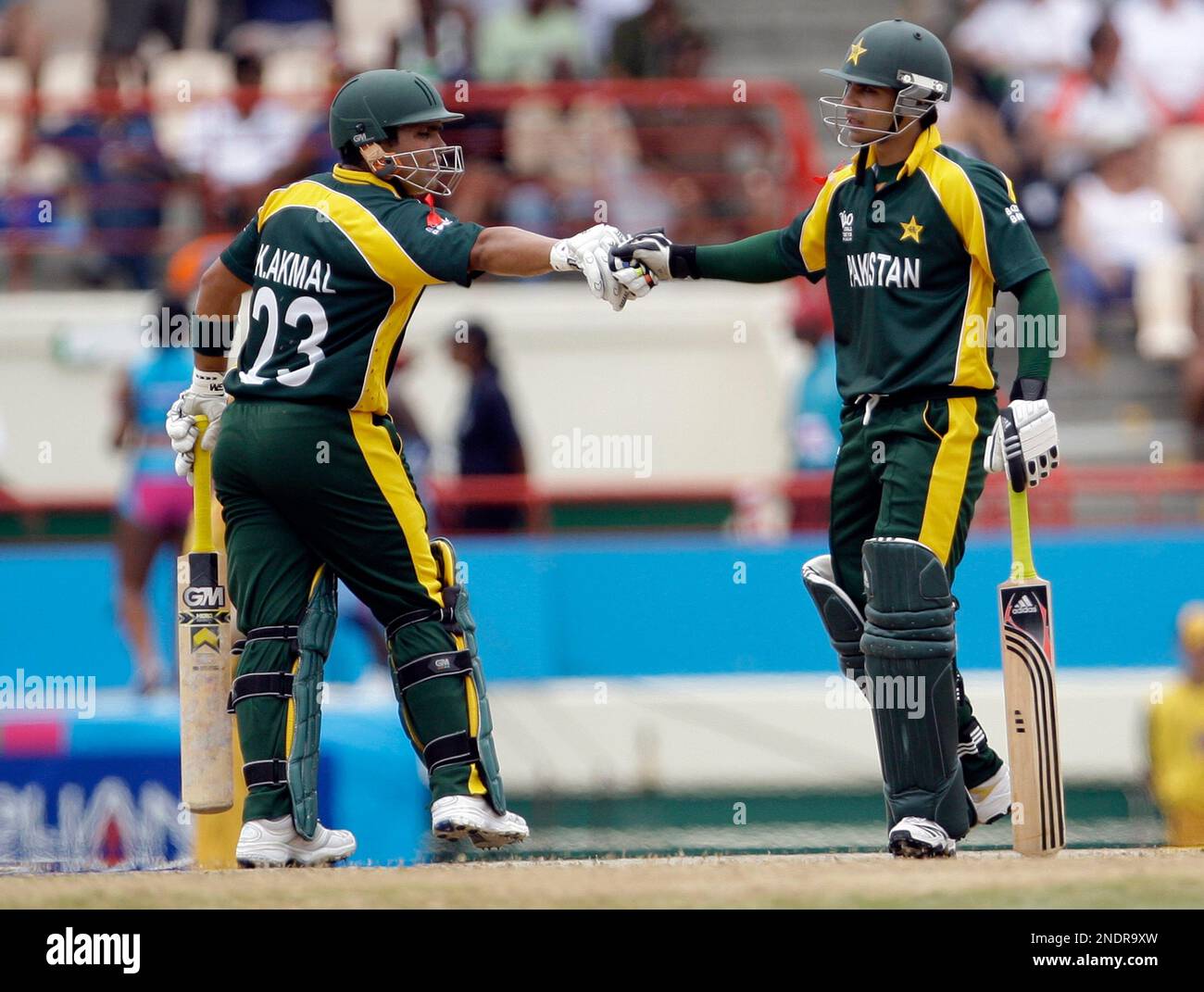 Pakistan's Kamran Akmal, Left, And Teammate Salman Butt Gesture At A ...