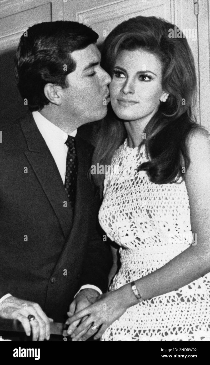 Miniskied actress Raquel Welch gets neck on the cheek from her husband