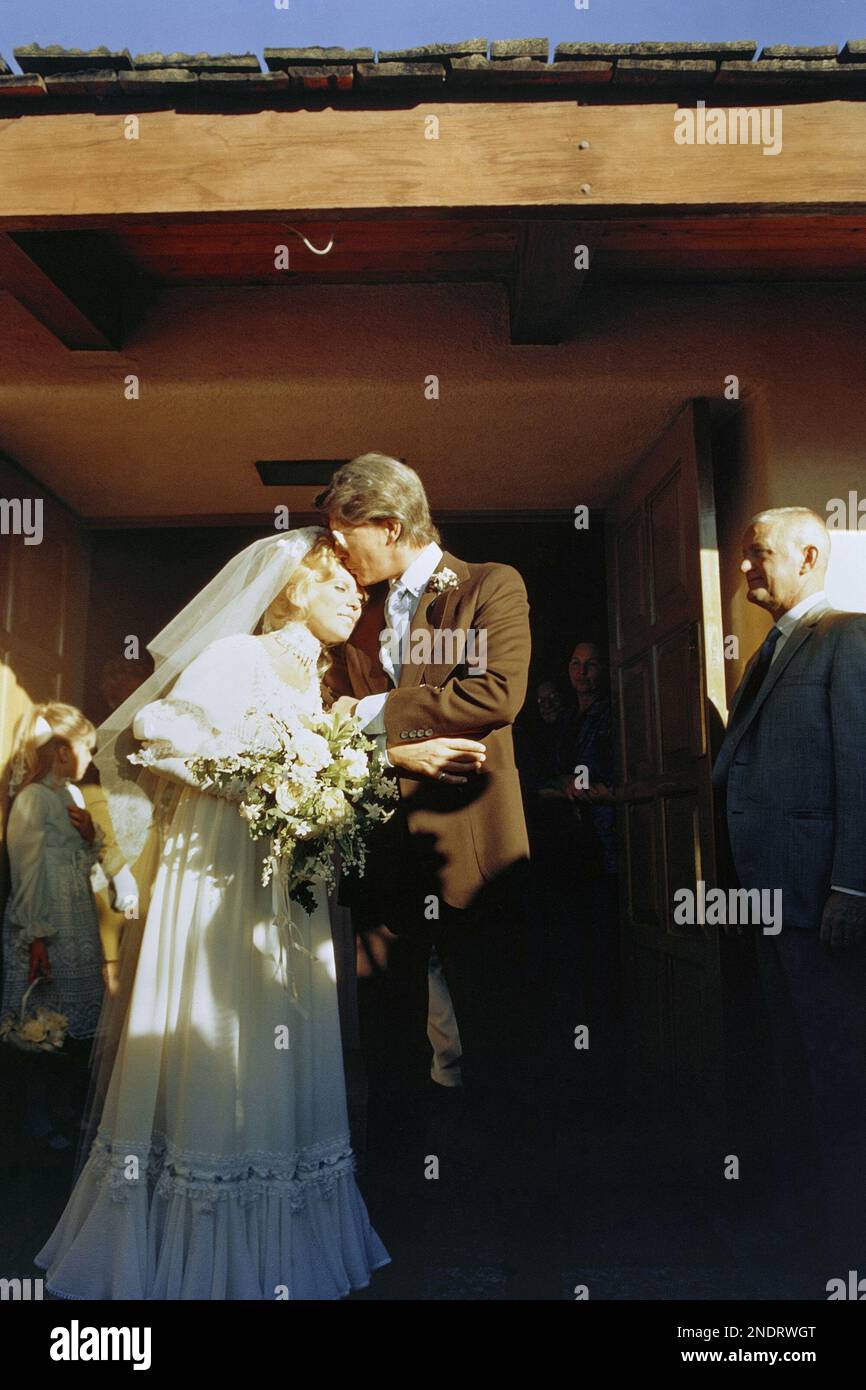 Nancy Sinatra is kissed by her new husband, Hugh Lambert, at their ...