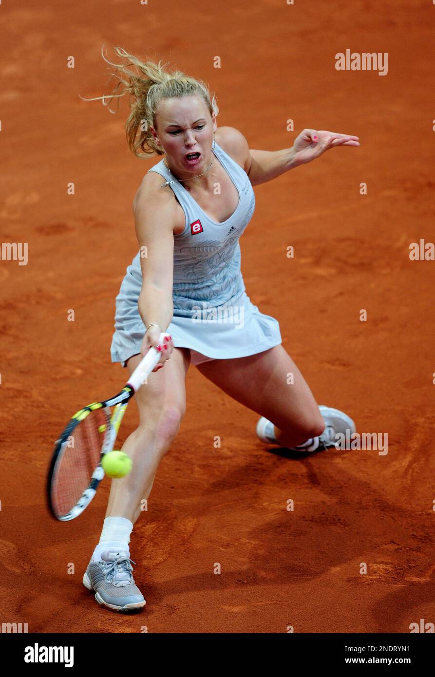 Caroline Wozniack from Denmark returns the ball during her match