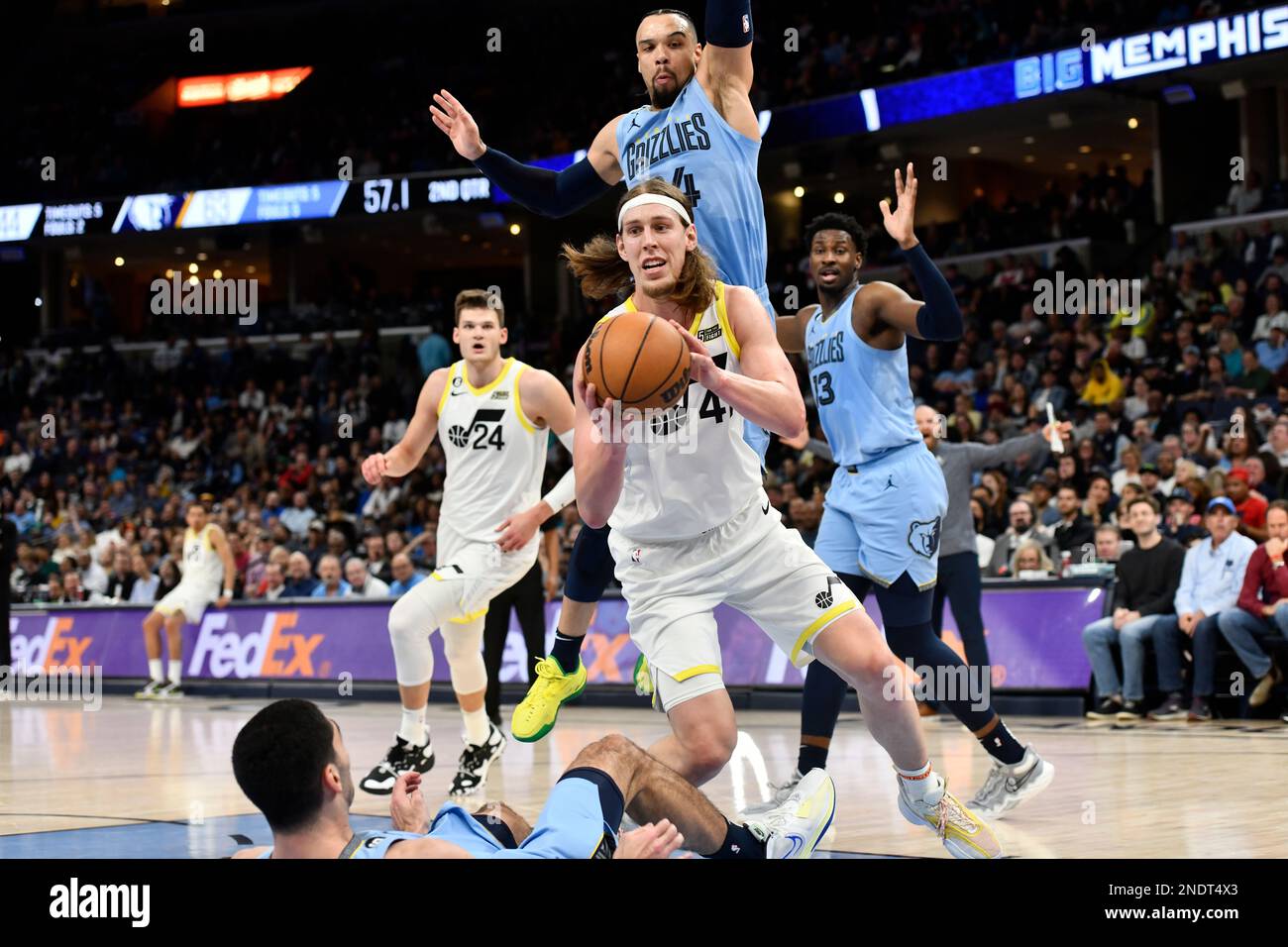 Utah Jazz forward Kelly Olynyk (41) handles the ball between Memphis