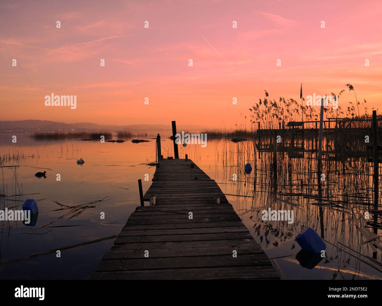 Serene lakeside twilight pier hi-res stock photography and images - Alamy