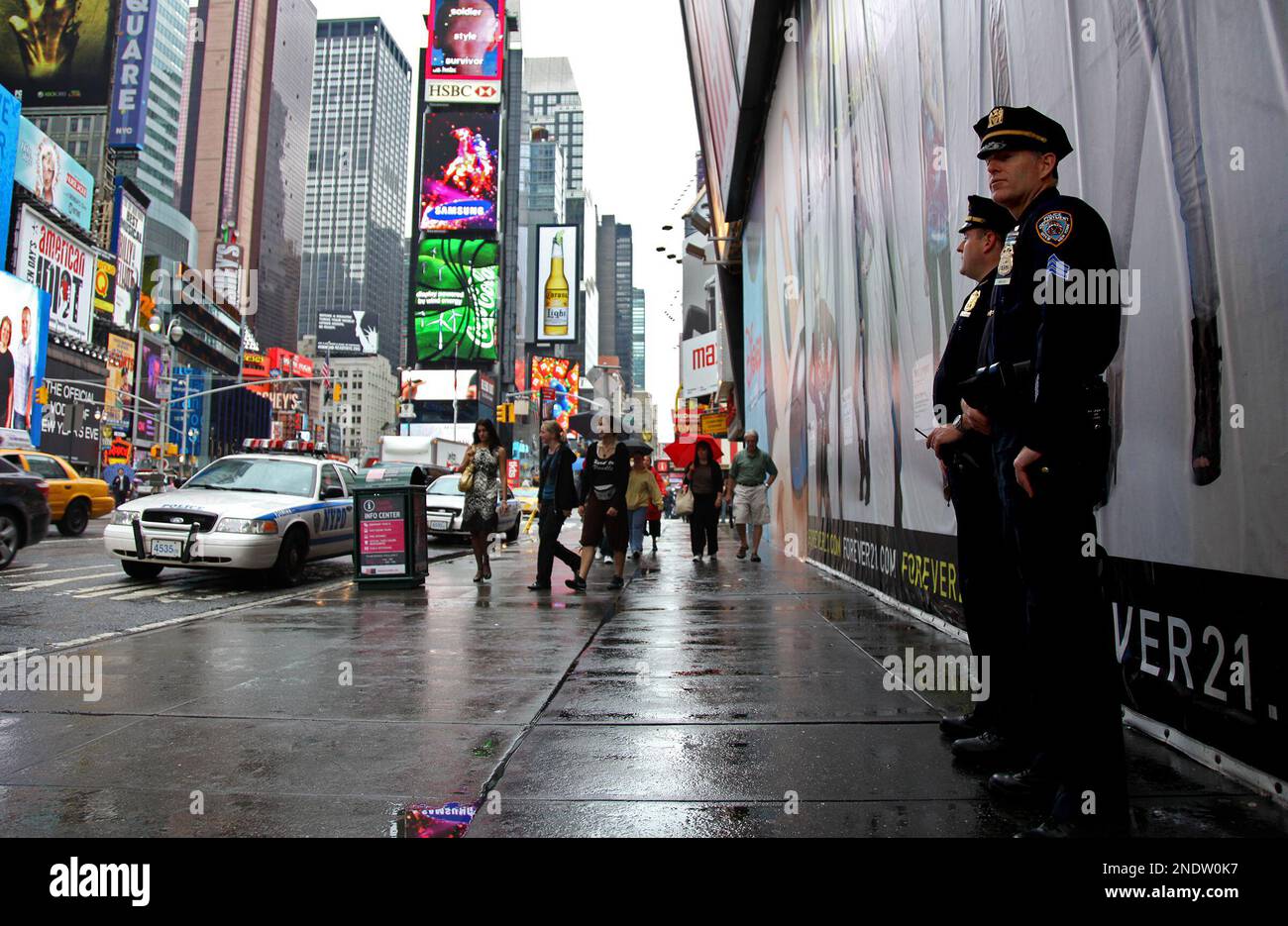 New York City police officers stand watch on Times Square in New York ...