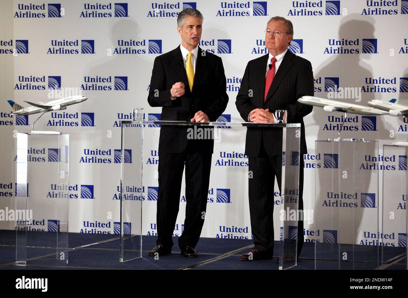 Continental Airlines CEO Jeff Smisek, left, speaks as United Airlines CEO Glenn Tilton stands with him at a news conference in New York Monday, May 3, 2010. United Airlines is purchasing Continental Airlines. (AP Photo/Craig Ruttle) Stock Photo