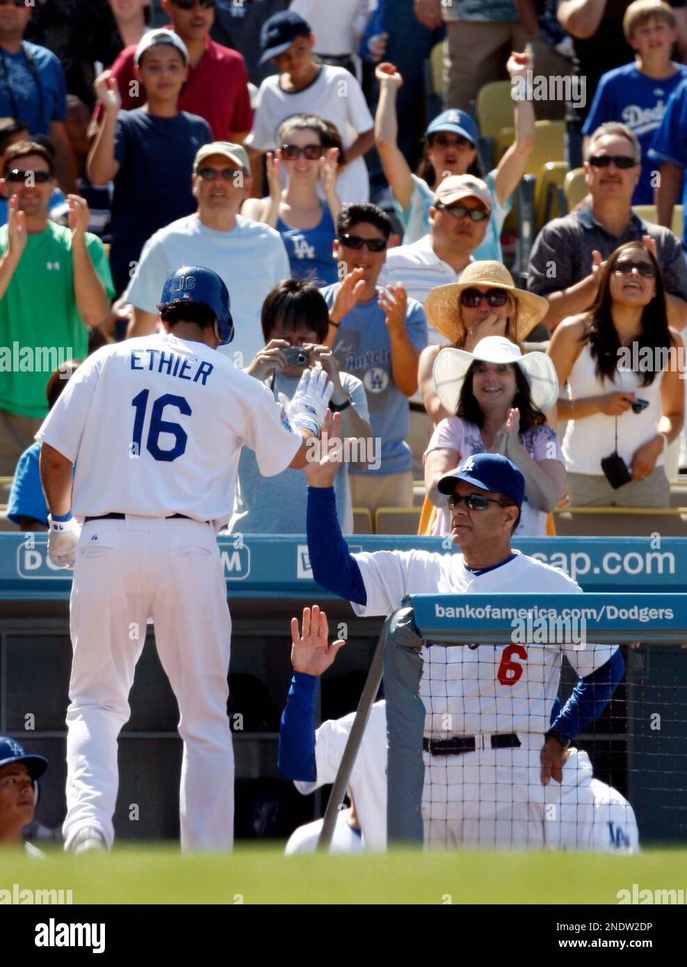 Los Angeles Dodgers' Andre Ethier gets congratulated by manager Joe
