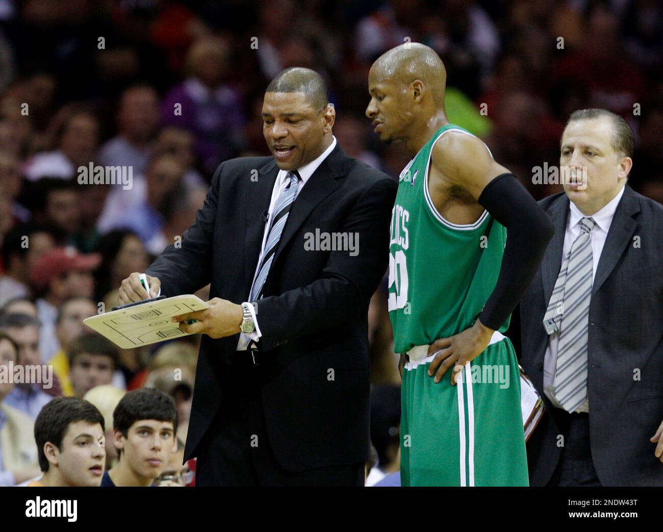 Boston Celtics coach Doc Rivers, left, diagrams a play for Ray Allen ...