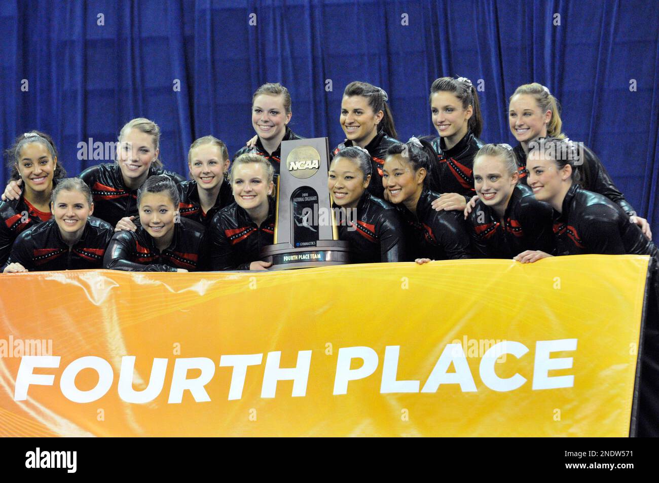 Georgia's women gymnasts pose with the fourth-place team trophy at the ...