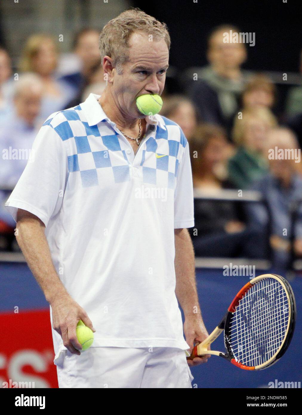 John McEnroe gets ready to serve the ball in a Champions Cup semifinal  tennis match against Bjorn Borg, Saturday, May 1, 2010, in Boston. McEnroe  won 6-4, 7-6 (7-3). (AP Photo/Michael Dwyer Stock Photo - Alamy