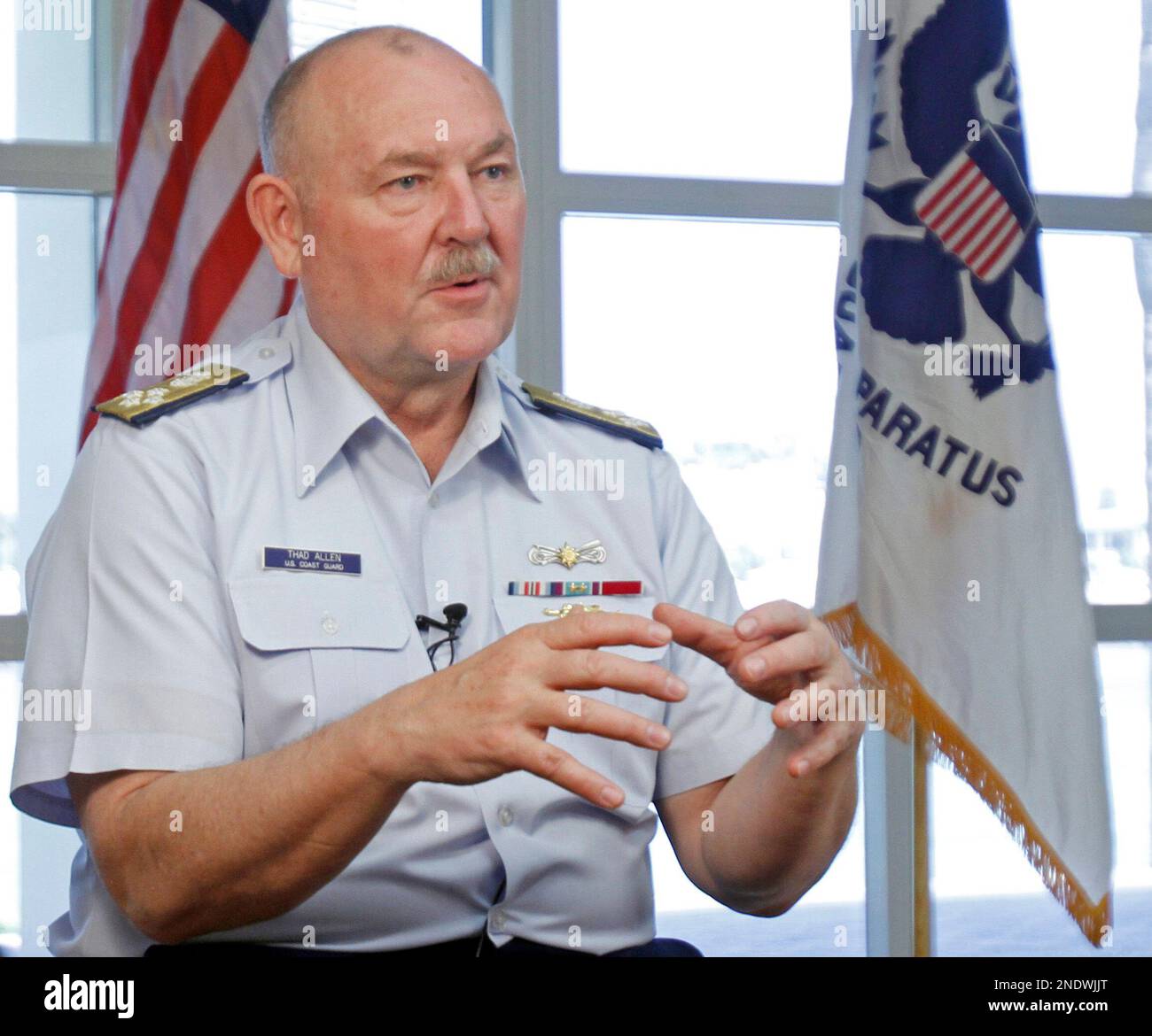 Admiral Thad Allen, Commandant of the U. S. Coast Guard, talks to a