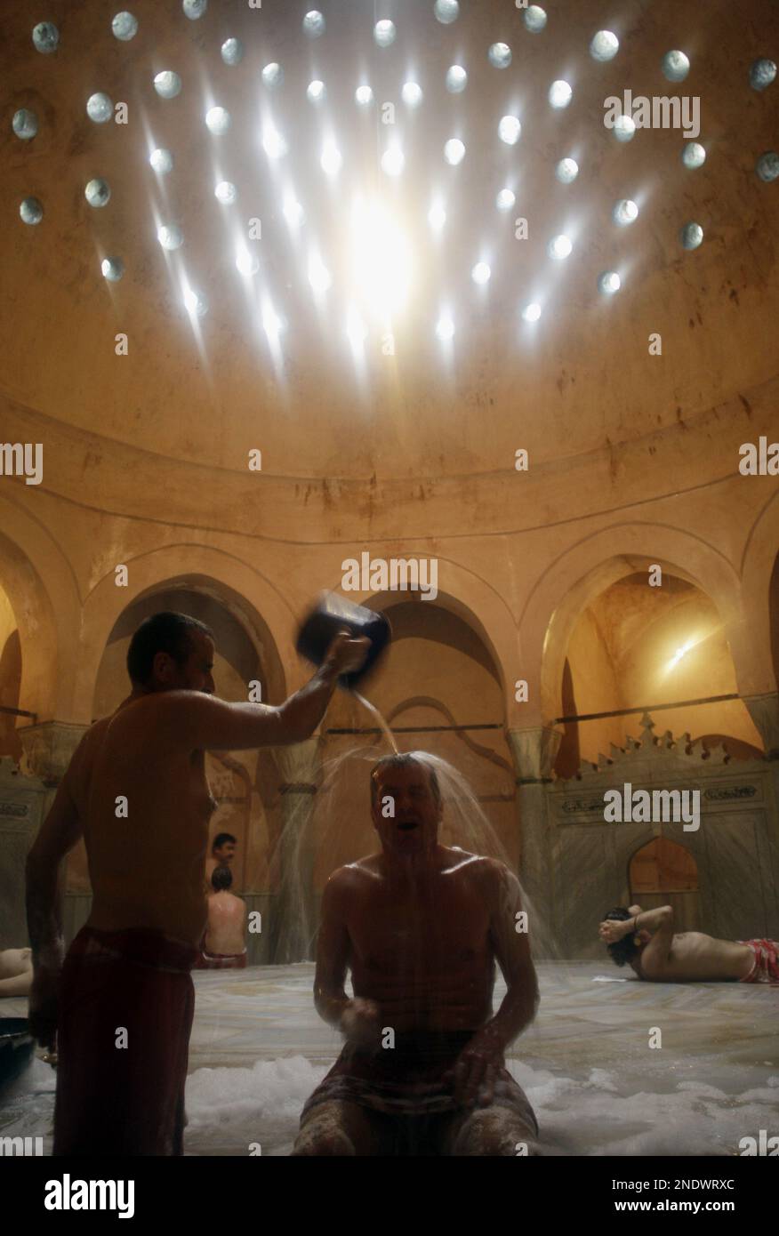 A tourist enjoys a traditional bath in the historic Cemberlitas Hamami