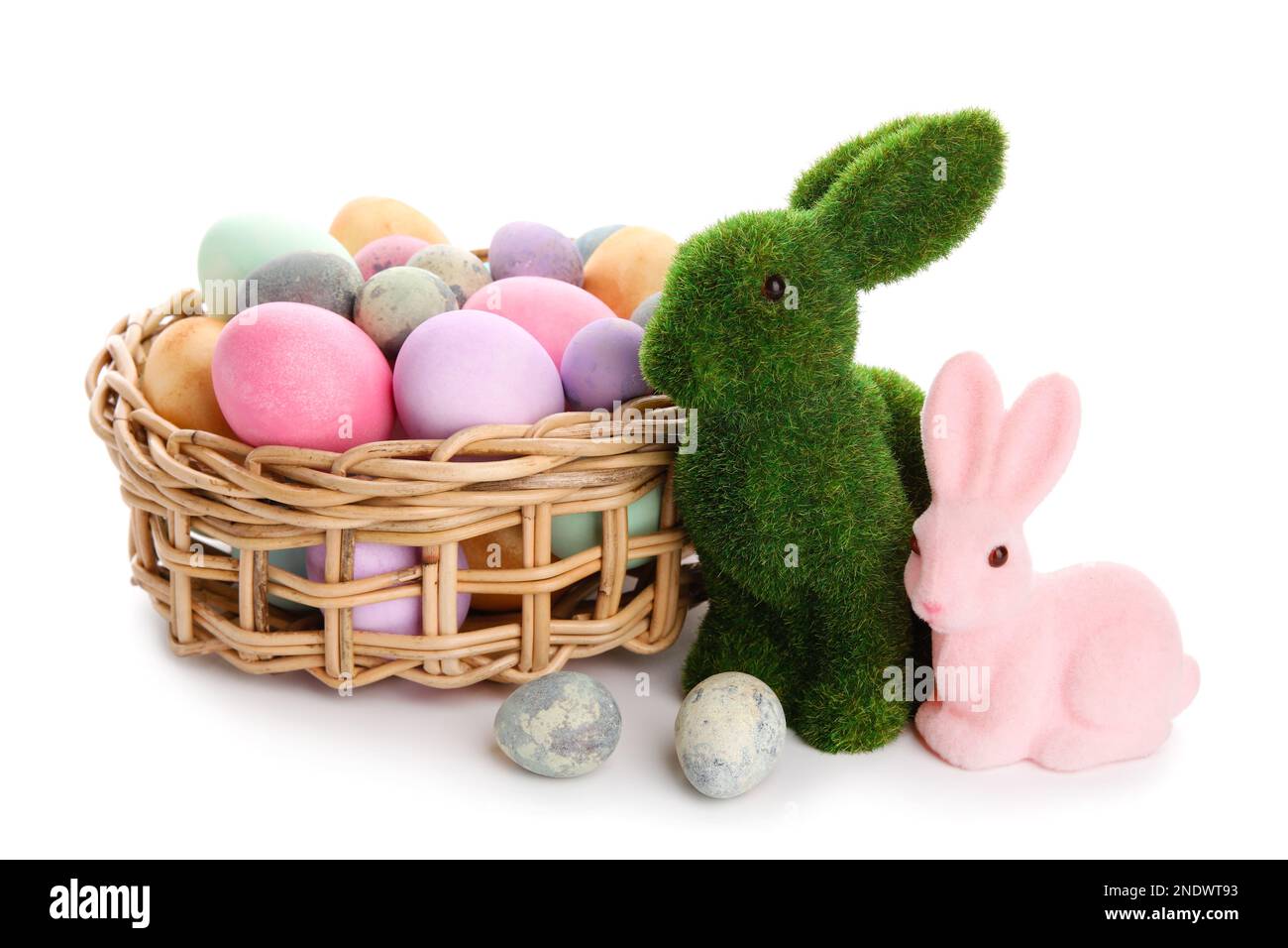 Easter bunnies and wicker basket with painted eggs isolated on white ...