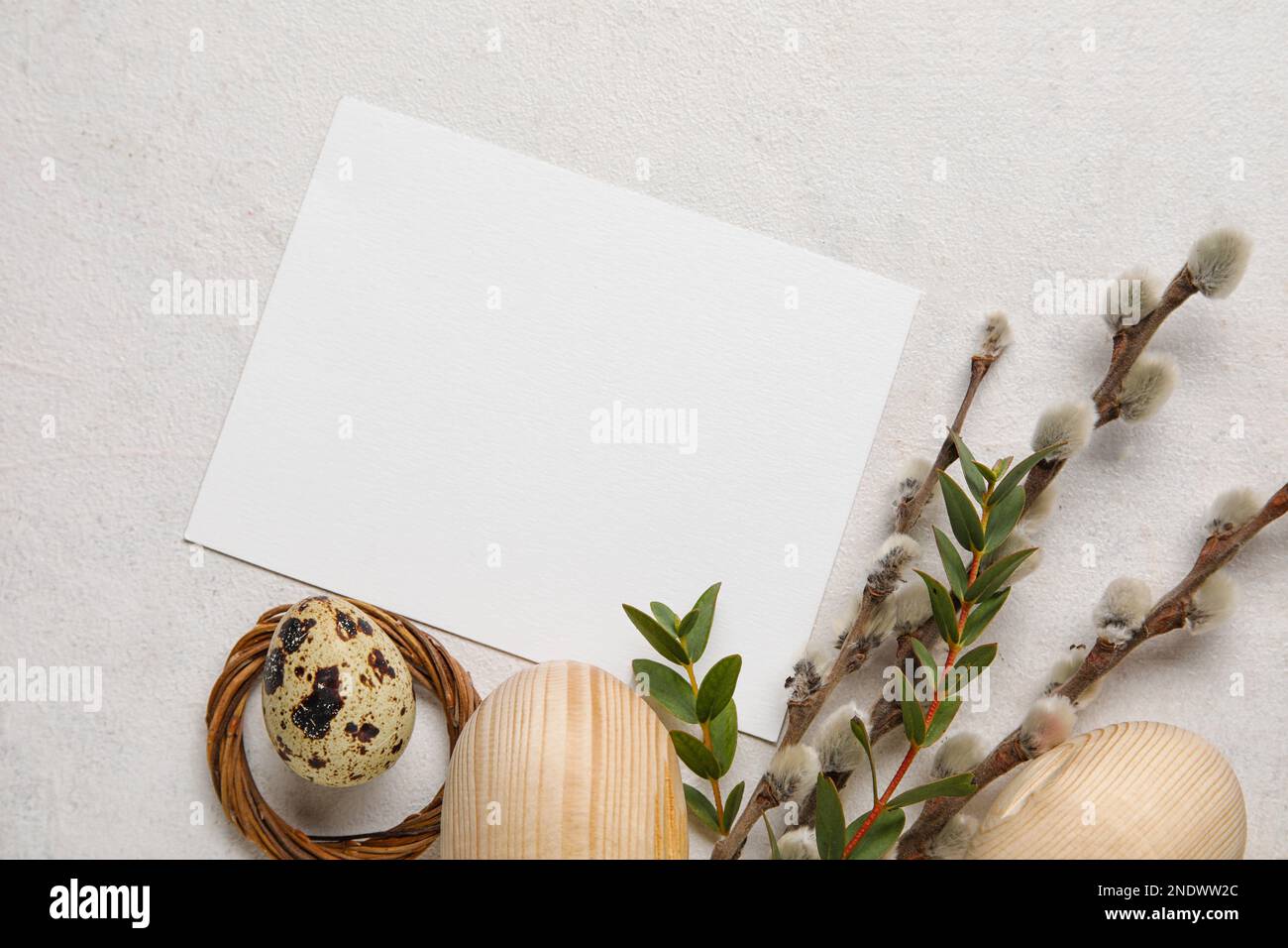Blank card with Easter eggs and willow branches on white background ...