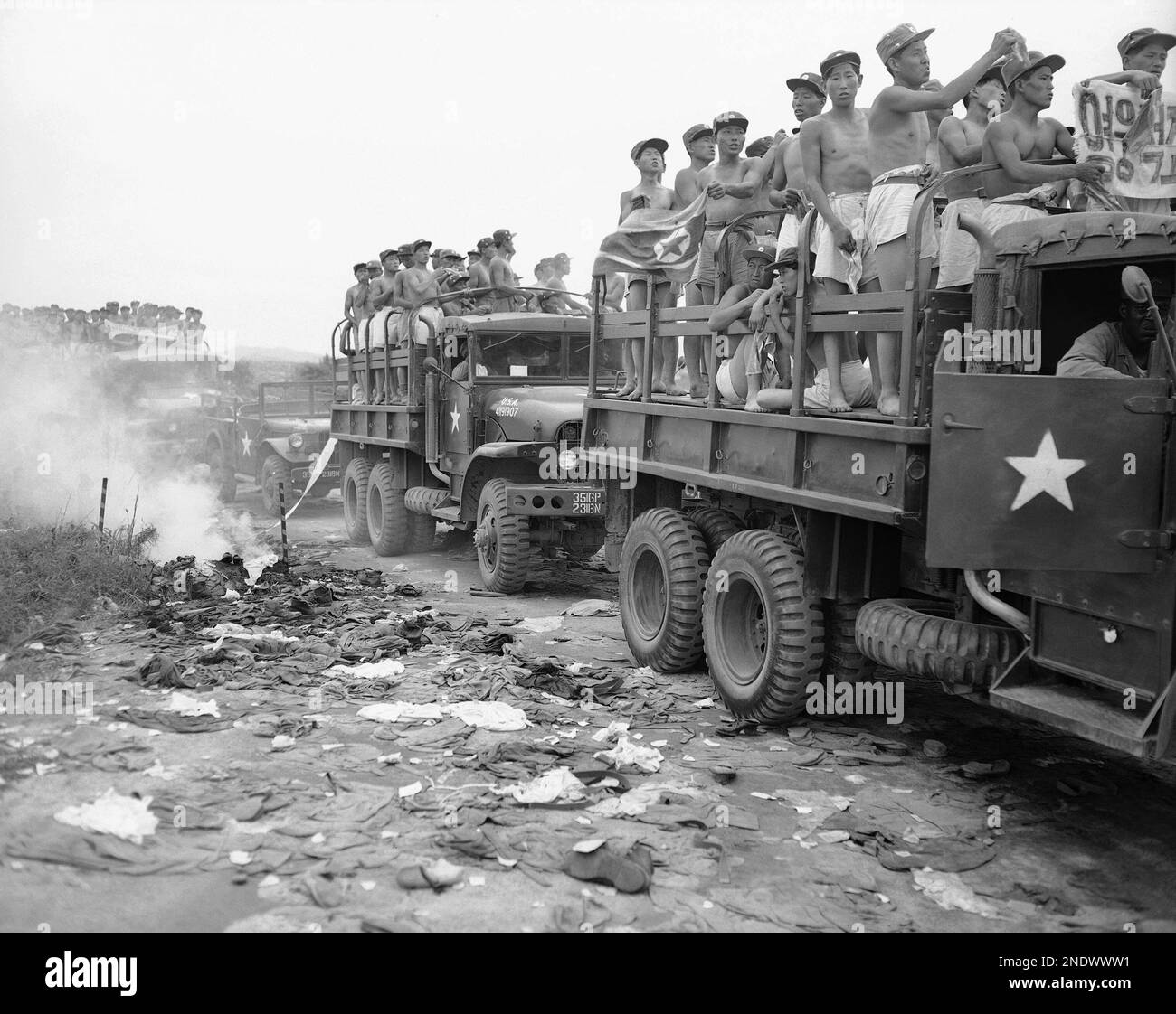 Trucks loaded with communist prisoners about to be exchanged wait on ...