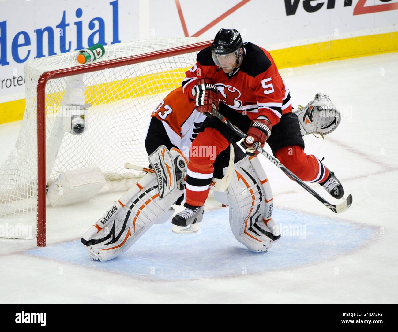 New Jersey Devils Colin White (5) and Tampa Bay Lightning Dan Boyle (22)  battle for the puck during the first period at the Continental Airlines  Arena in East Rutherford New Jersey on