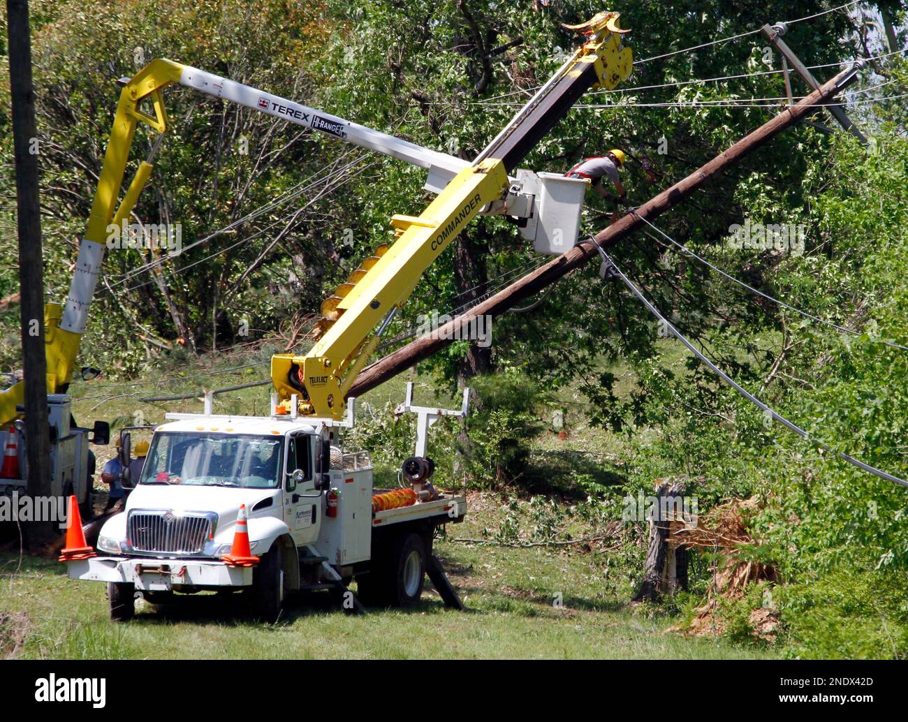 Utility companies remove damaged power poles around Yazoo City, Miss