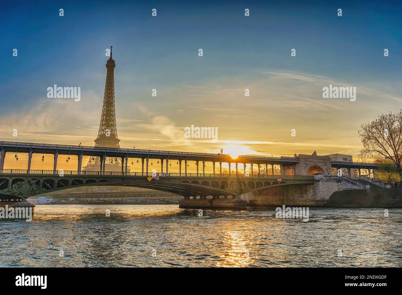 Paris France sunrise city skyline at Eiffel Tower and Seine River Bir-Hakeim Bridge Stock Photo