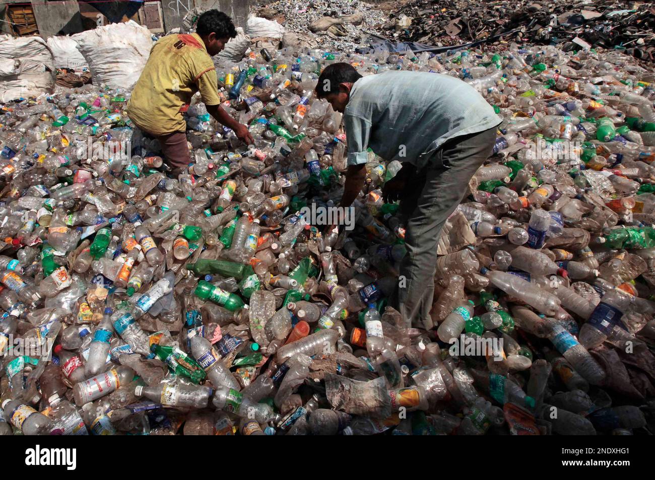 Ragpickers sort out plastic waste in Mumbai, India, Thursday, April 22