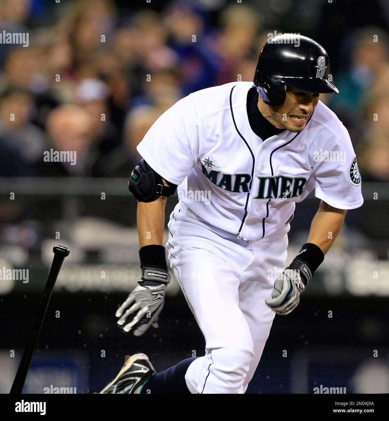 Photo: Seattle Mariners' Ichiro Suzuki drops for getting hit by a