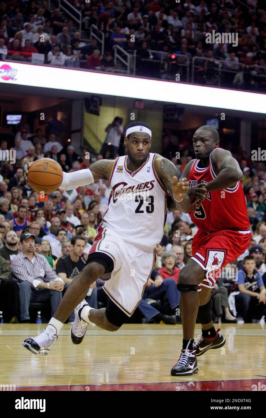 Cleveland Cavaliers LeBron James 23 drives past Chicago Bulls Luol Deng 9 during Game 2 in