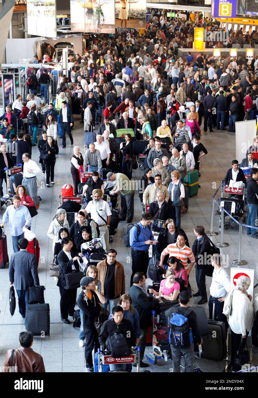 Hundreds of passengers check out their flight options in a