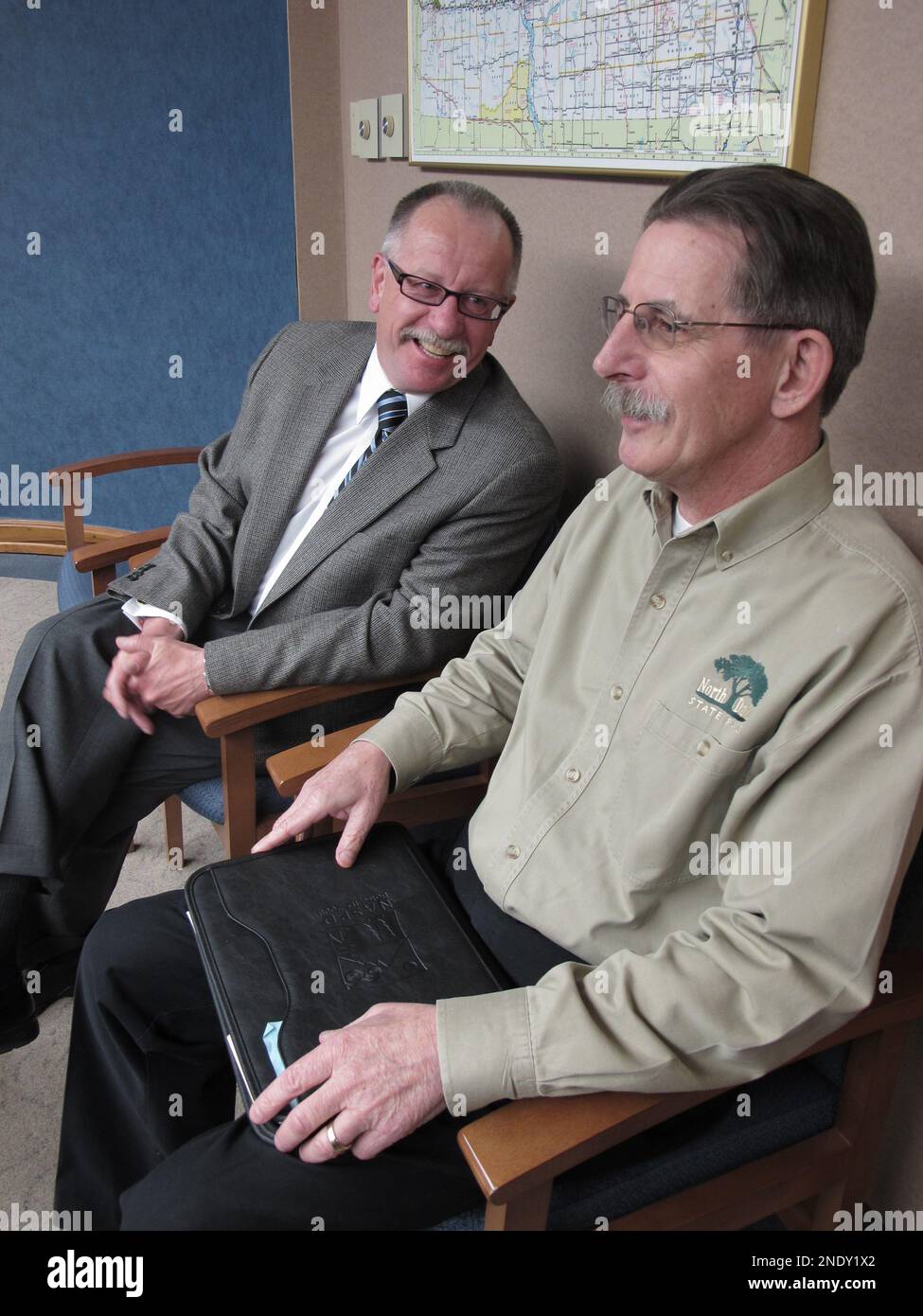 Mark Zimmerman, left, the new director of North Dakota's Department of
