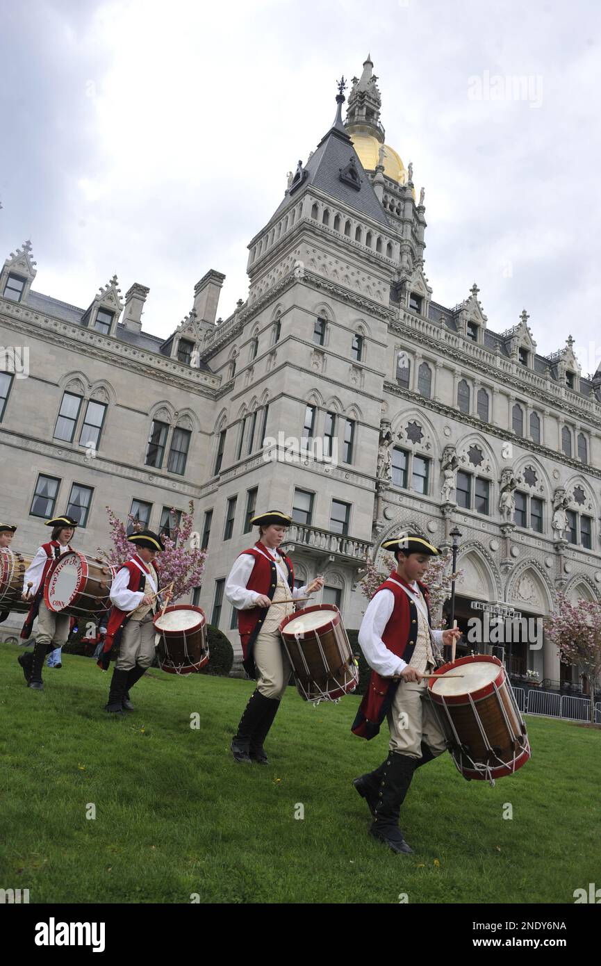 Members of the Deep River Junior Ancient Fife and Drum Corp march past