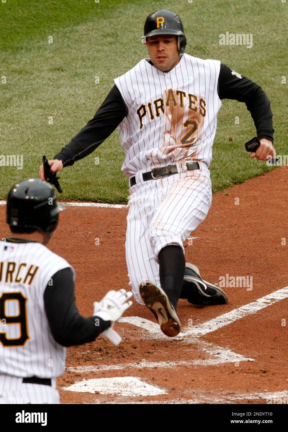 Pittsburgh Pirates' Bobby Crosby (2) scores on a threerun double by