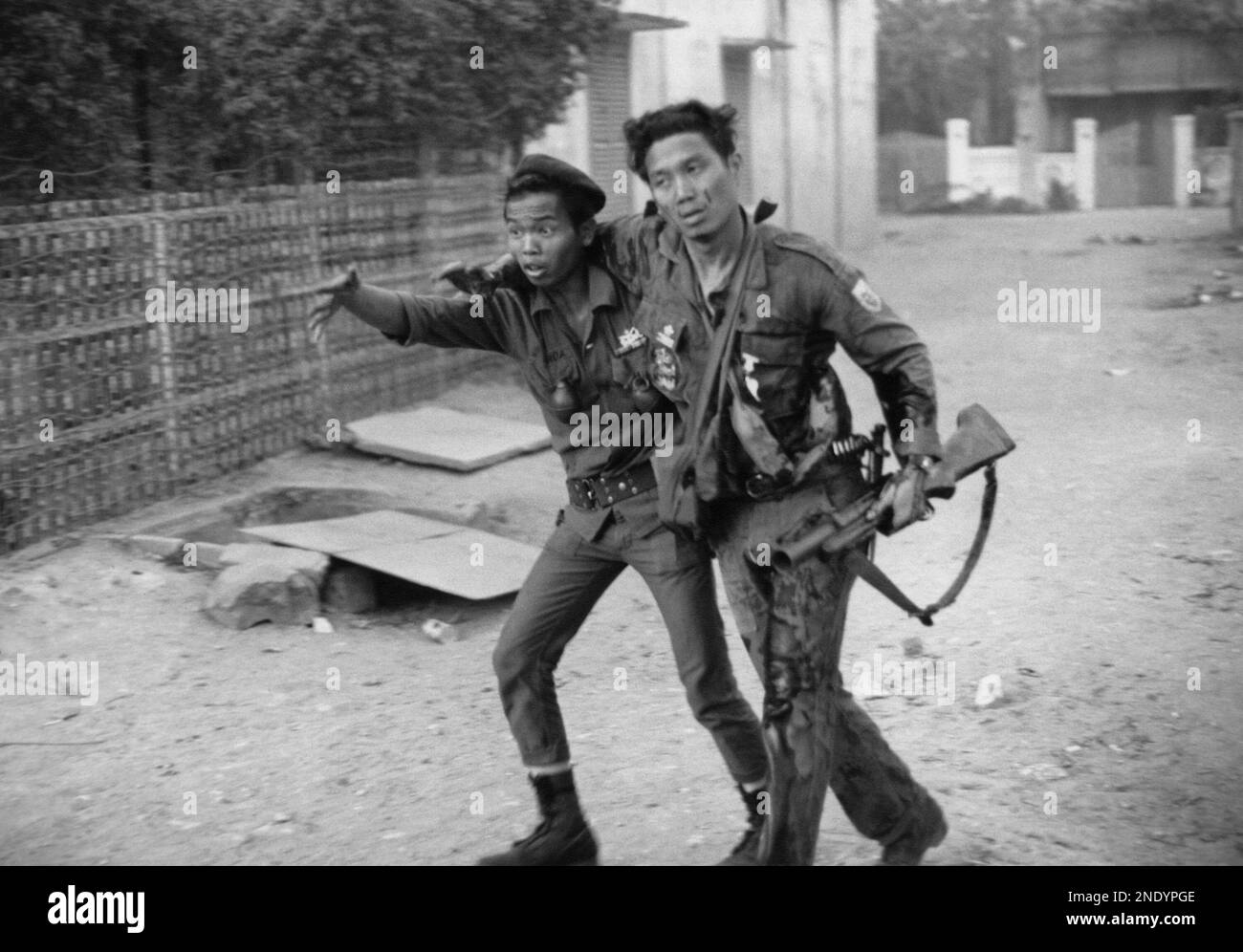 A South Vietnamese soldier gestures for help in Cholon, the Chinese ...