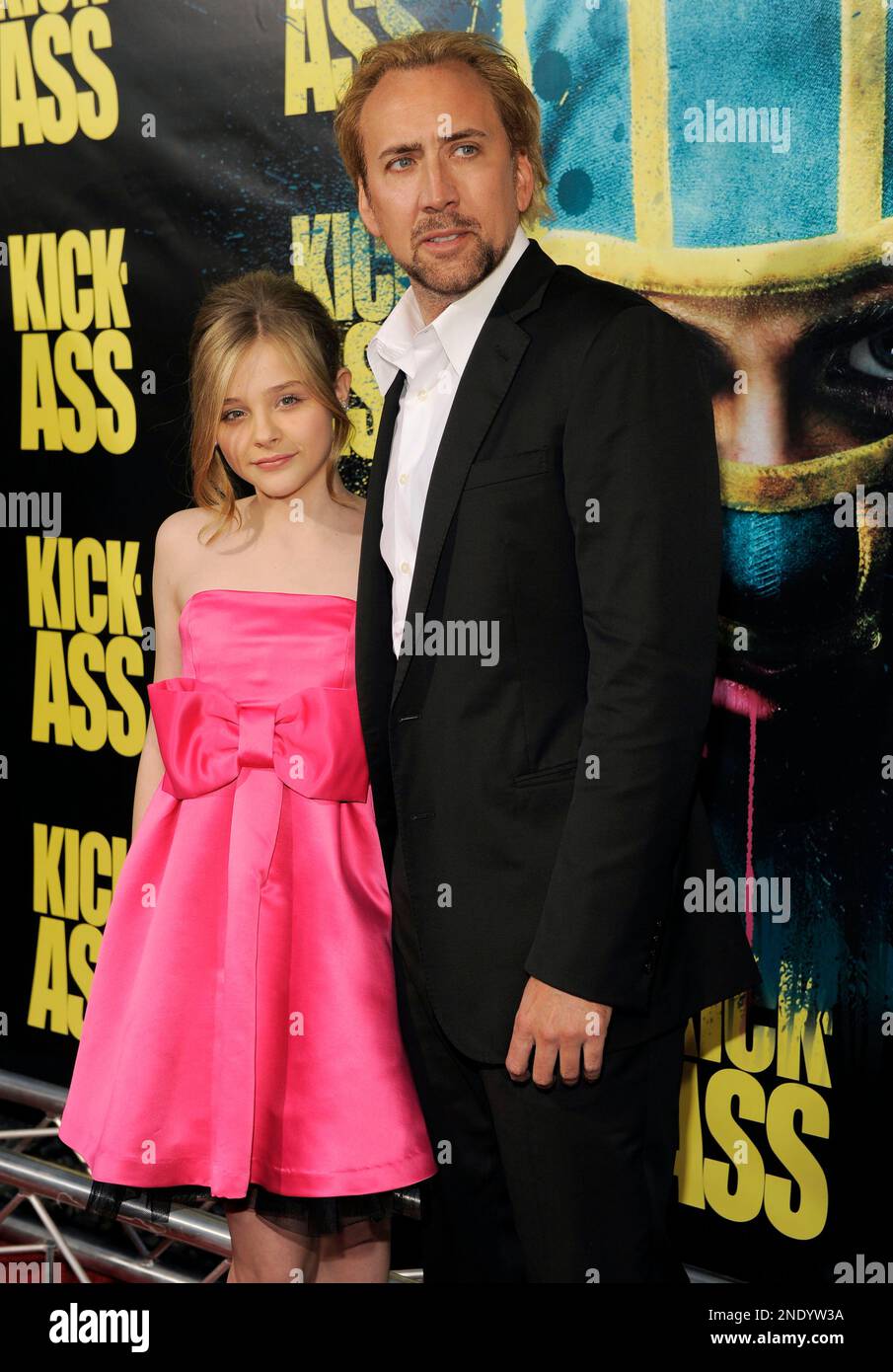 Chloe Grace Moretz, left, and Nicolas Cage, cast members in the film  Kick-Ass, pose together at the premiere of the film in Los Angeles,  Tuesday, April 13, 2010. (AP Photo/Chris Pizzello Stock