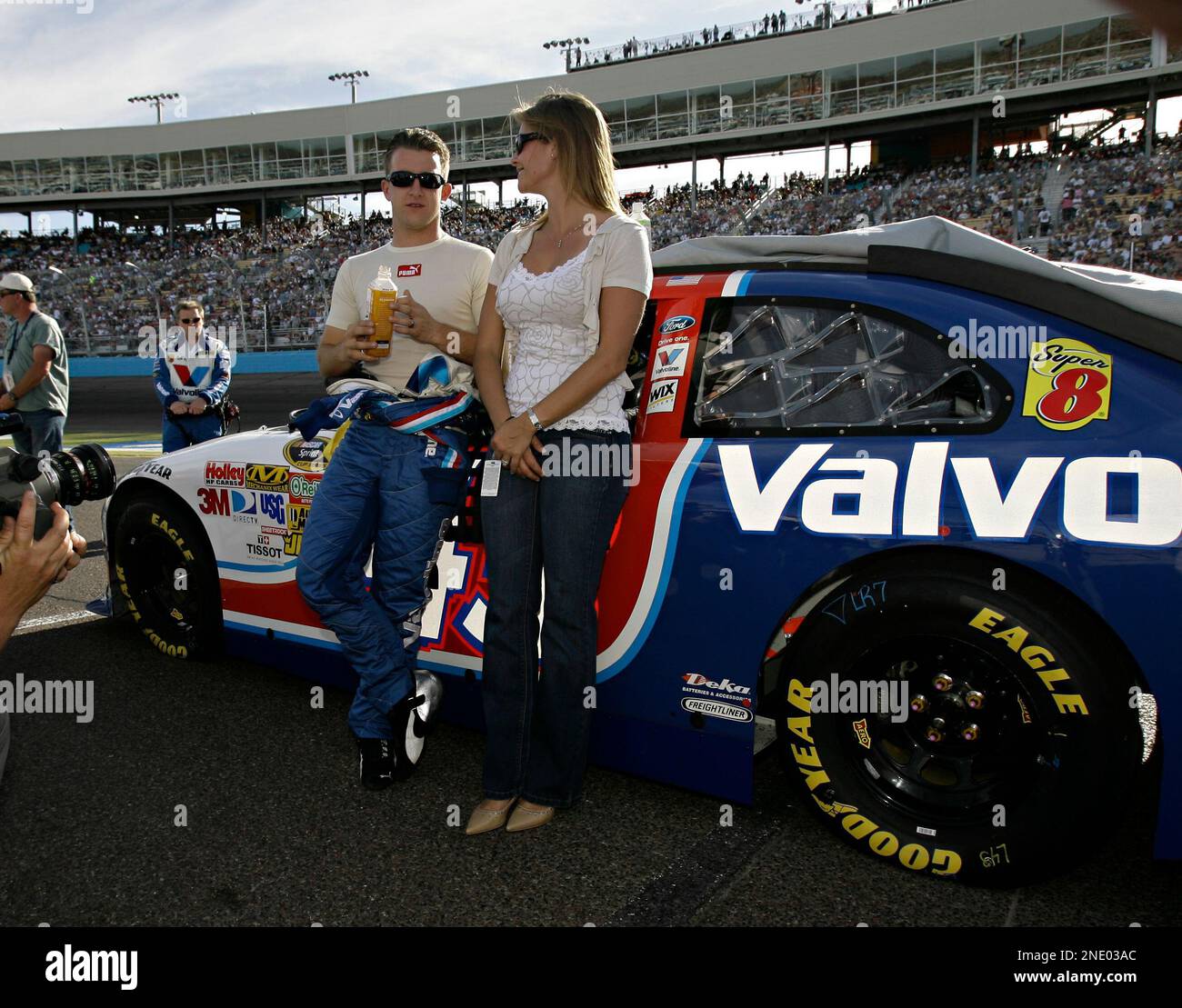 A.J. Allmendinger and his wife Lynne Allmendinger stand alongside his