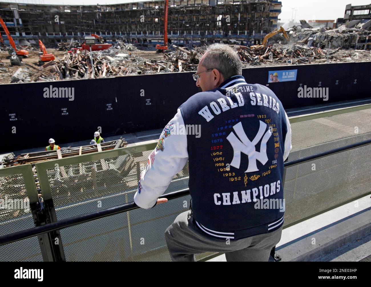New York Yankees fan Bruce Dain overlooks the demolition of the old
